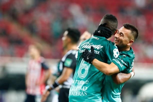 William Tesillo of Leon celebrates with his teammate after scoring the first goal of his team during the 5th round match between Chivas and Leon as...