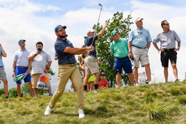 Jason Day of Australia hits his second shot at the 18th hole during the first round of THE NORTHERN TRUST at Liberty National Golf Club on August 19,...