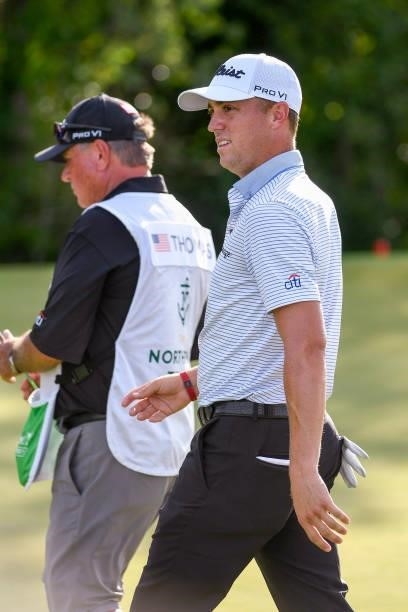 Justin Thomas leaves the 17th green after making birdie during the first round of THE NORTHERN TRUST at Liberty National Golf Club on August 19, 2021...