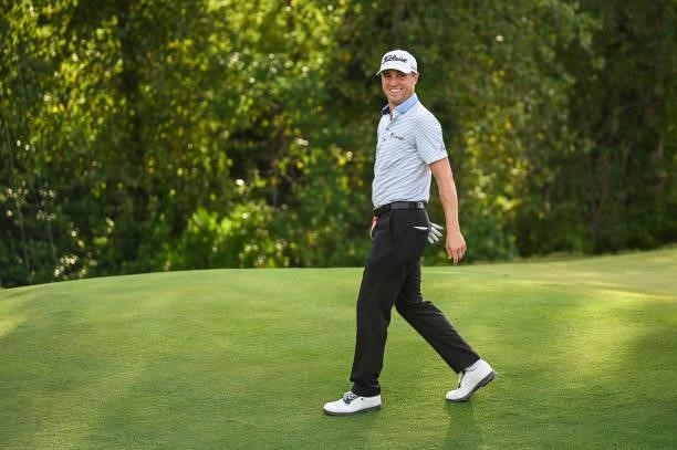 Justin Thomas smiles after making a birdie putt on the 17th hole green during the first round of THE NORTHERN TRUST, the first event of the FedExCup...