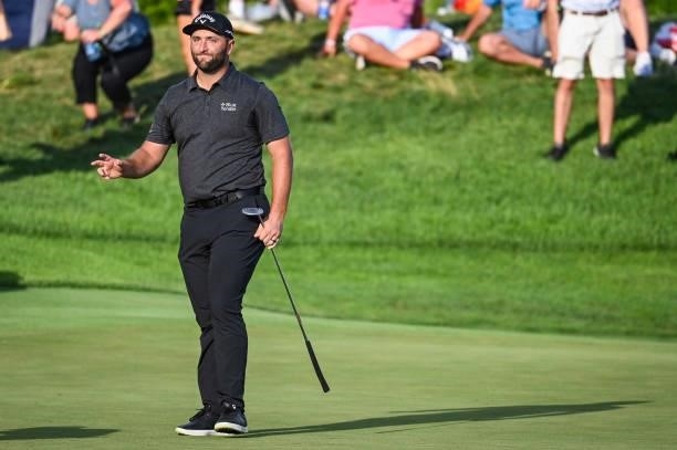 Jon Rahm of Spain waves to fans after making a par putt on the 18th hole green during the first round of THE NORTHERN TRUST, the first event of the...