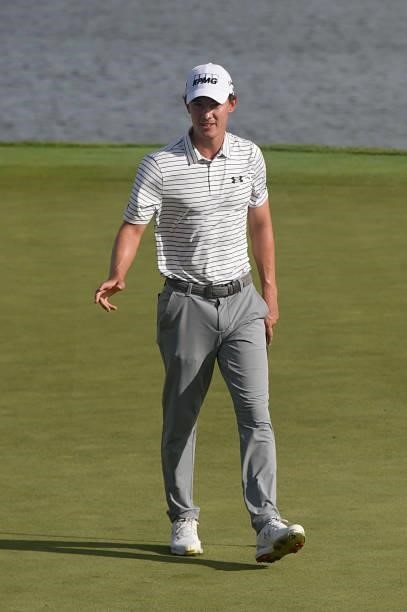 Maverick McNealy sinks his putt on the 18th fairway during the first round of THE NORTHERN TRUST at Liberty National Golf Club on August 19, 2021 in...