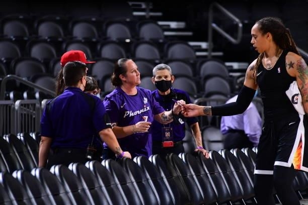 Brittney Griner of the Phoenix Mercury signs autographs for fans before the game against the Washington Mystics on August 19, 2021 at Phoenix Suns...