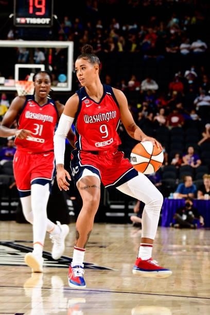 Natasha Cloud of the Washington Mystics handles the ball during the game against the Phoenix Mercury on August 19, 2021 at Footprint Center in...