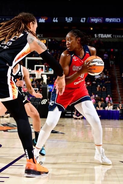 Tina Charles of the Washington Mystics handles the ball during the game against the Phoenix Mercury on August 19, 2021 at Footprint Center in...