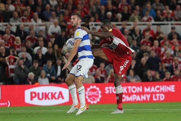 Uche Ikpeazu of Midddlesbrough in action with Dominic Ball of Queens Park Rangers during the Sky Bet Championship match between Middlesbrough and...