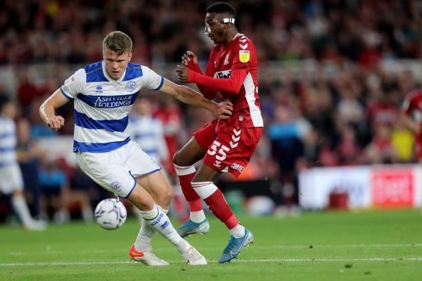 Middlesbrough's Isaiah Jones in action with Queens Park Rangers' Rob Dickie during the Sky Bet Championship match between Middlesbrough and Queens...