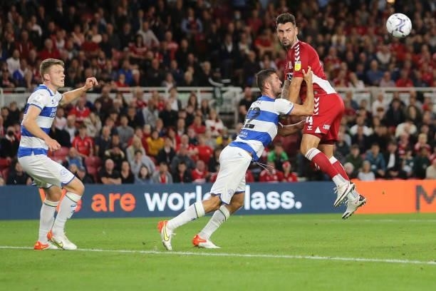 Middlesbrough's Grant Hall contests a header with Queens Park Rangers' Dominic Ball during the Sky Bet Championship match between Middlesbrough and...