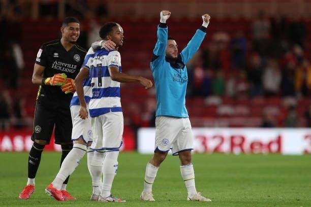 Queens Park Rangers' Ilias Chair celebrates with Seny Dieng and Chris Willock after the final whislte of the Sky Bet Championship match between...