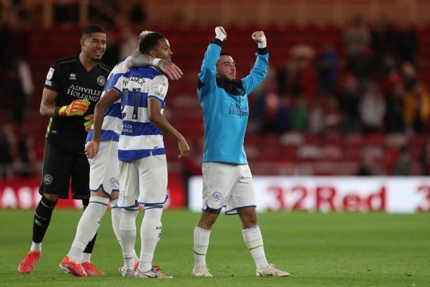 Queens Park Rangers' Ilias Chair celebrates with Seny Dieng and Chris Willock after the final whislte of the Sky Bet Championship match between...
