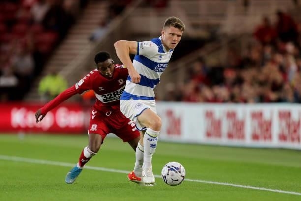 Queens Park Rangers' Rob Dickie in action with Middlesbrough's Isaiah Jones during the Sky Bet Championship match between Middlesbrough and Queens...