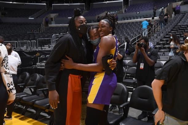 Chiney Ogwumike and Nneka Ogwumike of the Los Angeles Sparks hug after the win against the Atlanta Dream on August 19, 2021 at the Staples Center in...