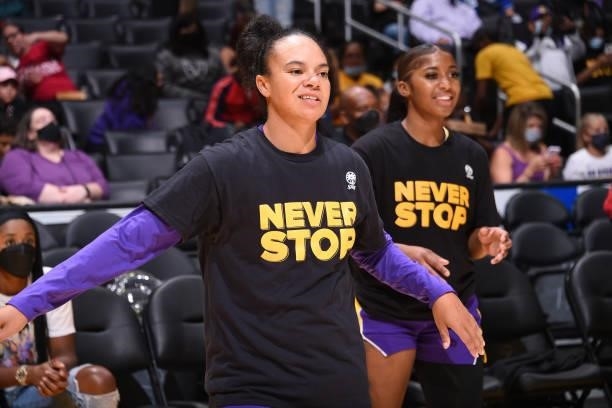 Kristi Toliver and Te'a Cooper of the Los Angeles Sparks smile before the game against the Atlanta Dream on August 19, 2021 at the Staples Center in...