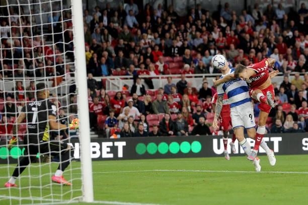 Queens Park Rangers' Lyndon Dykes holds Middlesbrough's Dael Fry to concede a penalty during the Sky Bet Championship match between Middlesbrough and...