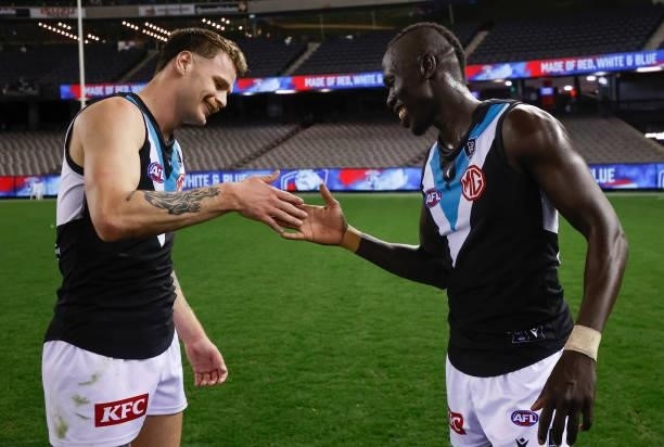 Peter Ladhams and Aliir Aliir of the Power celebrate during the 2021 AFL Round 23 match between the Western Bulldogs and the Port Adelaide Power at...