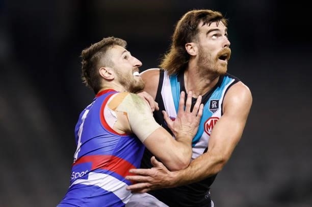 Marcus Bontempelli of the Bulldogs and Scott Lycett of the Power compete in a ruck contest during the 2021 AFL Round 23 match between the Western...