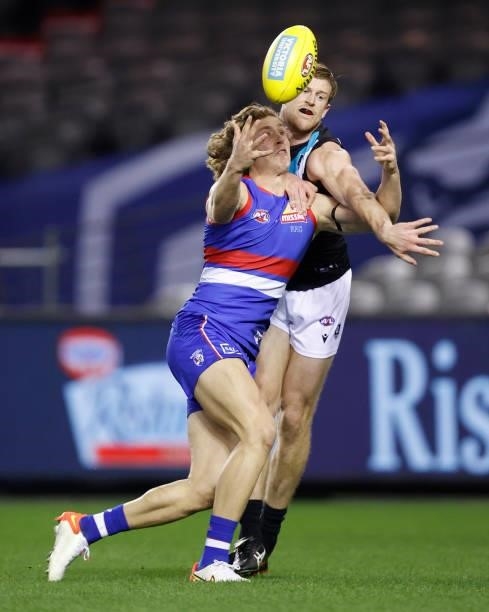 Aaron Naughton of the Bulldogs and Tom Jonas of the Power during the 2021 AFL Round 23 match between the Western Bulldogs and the Port Adelaide Power...