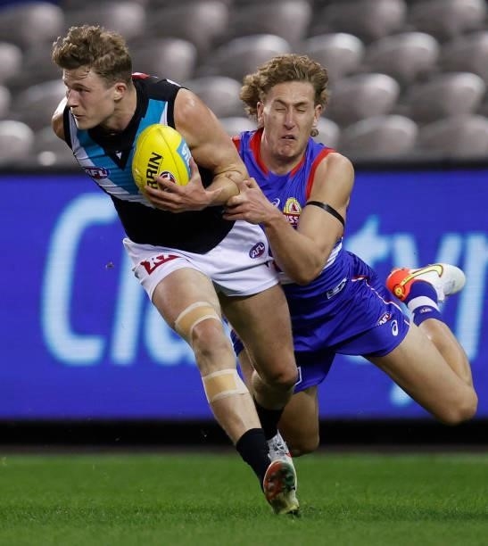 Xavier Duursma of the Power and Aaron Naughton of the Bulldogs in action during the 2021 AFL Round 23 match between the Western Bulldogs and the Port...
