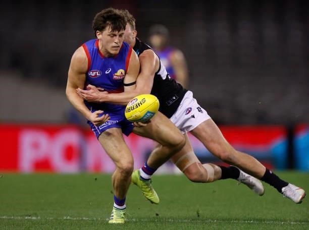Laitham Vandermeer of the Bulldogs is tackled by Xavier Duursma of the Power during the 2021 AFL Round 23 match between the Western Bulldogs and the...
