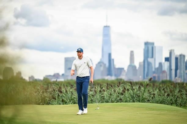 Scenic view of the New York skyline as Daniel Berger waves after making a birdie putt on the 14th hole green during the second round of THE NORTHERN...