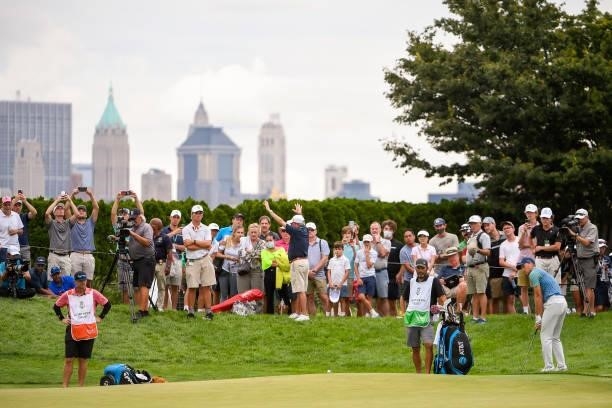 Jordan Spieth chips up to the 18th green during the second round of THE NORTHERN TRUST at Liberty National Golf Club on August 20, 2021 in Jersey...
