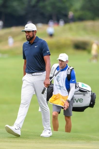 Tony Finau walks up to the 17th hole with putter during the second round of THE NORTHERN TRUST at Liberty National Golf Club on August 20, 2021 in...