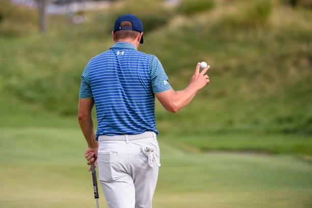 Jordan Spieth gives a ball wave at the 15th green during the second round of THE NORTHERN TRUST at Liberty National Golf Club on August 20, 2021 in...