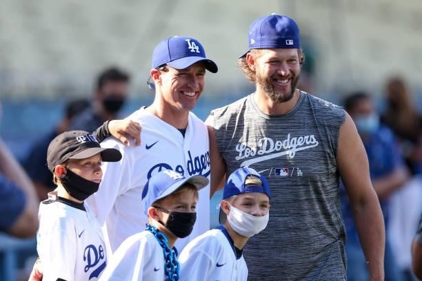 Former New Orleans Saints quarterback Drew Brees and his family is seen with Clayton Kershaw of the Los Angeles Dodgers before the game between the...
