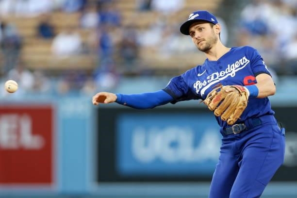 Trea Turner of the Los Angeles Dodgers throws the ball during the game between the New York Mets and the Los Angeles Dodgers at Dodgers Stadium on...