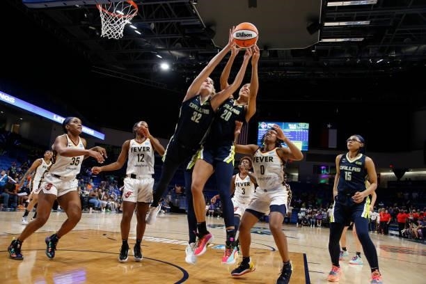 Isabelle Harrison of the Dallas Wings and Bella Alarie of the Dallas Wings rebound the ball during the game against the Indiana Fever on August 20,...