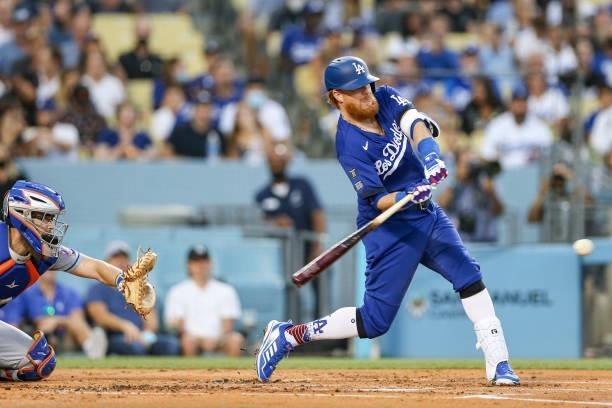 Justin Turner of the Los Angeles Dodgers hits an RBI single during the game between the New York Mets and the Los Angeles Dodgers at Dodgers Stadium...