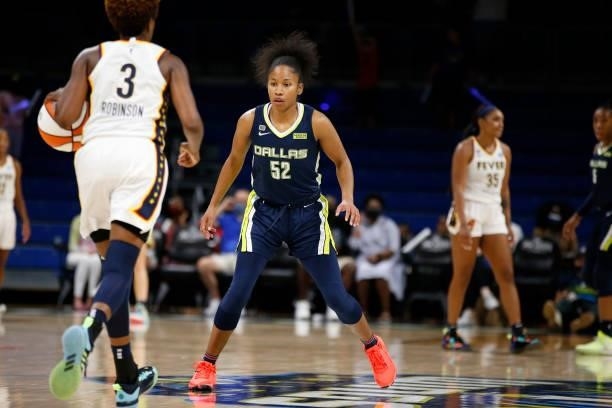 Tyasha Harris of the Dallas Wings plays defense on Danielle Robinson of the Indiana Fever during the game on August 20, 2021 at the College Park...