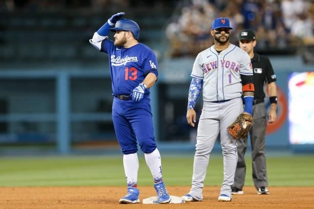 Max Muncy of the Los Angeles Dodgers celebrates hitting a two-run double during the game between the New York Mets and the Los Angeles Dodgers at...