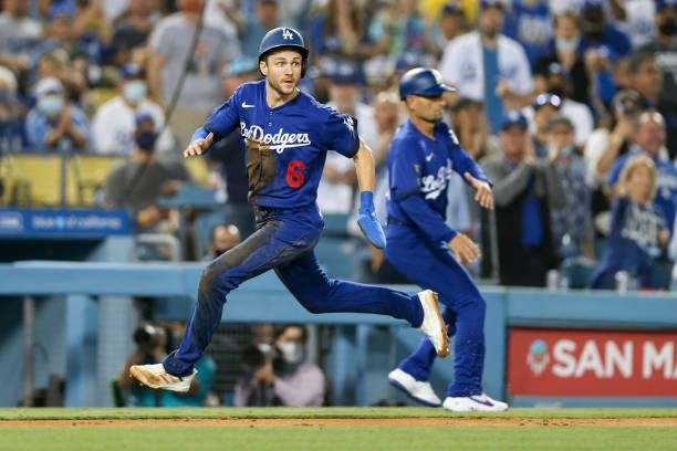 Trea Turner of the Los Angeles Dodgers rounds third to score during the game between the New York Mets and the Los Angeles Dodgers at Dodgers Stadium...