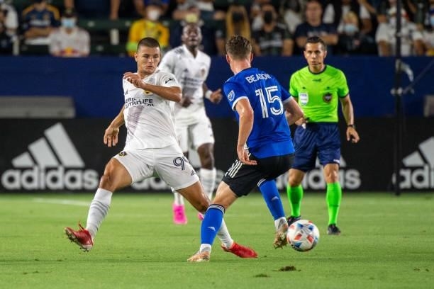 Tanner Beason of the San Jose Earthquakes controls the ball against Dejan Joveljic of Los Angeles Galaxy during the game at the Dignity Health Sports...