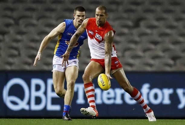 Lance Franklin of the Swans controls the ball ahead of Sam Collins of the Suns during the 2021 AFL Round 23 match between the Sydney Swans and the...