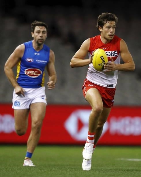 Oliver Florent of the Swans runs with the ball during the 2021 AFL Round 23 match between the Sydney Swans and the Gold Coast Suns at Marvel Stadium...