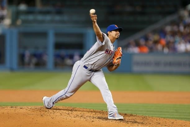 Carlos Carrasco of the New York Mets pitches during the game between the New York Mets and the Los Angeles Dodgers at Dodgers Stadium on Friday,...