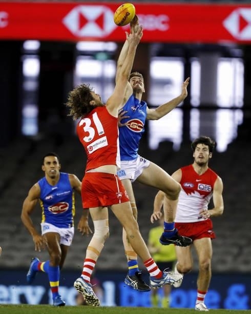 Tom Hickey of the Swans and Zac Smith of the Suns compete for the ball during the 2021 AFL Round 23 match between the Sydney Swans and the Gold Coast...