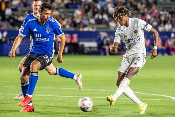 Kevin Cabral of Los Angeles Galaxy shoots the ball against Tanner Beason of the San Jose Earthquakes during the game at the Dignity Health Sports...