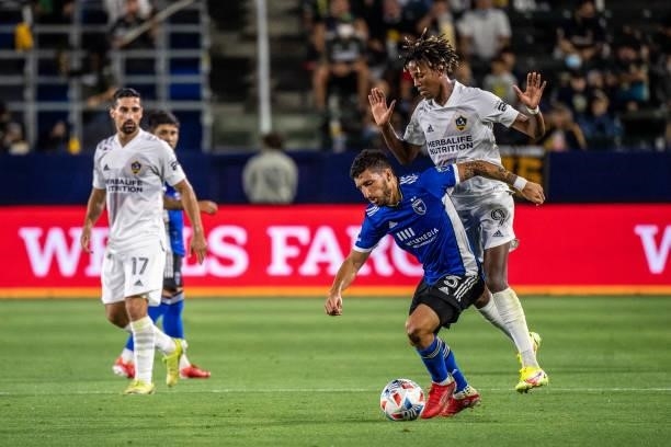 Eric Remedi of the San Jose Earthquakes battles Kevin Cabral of Los Angeles Galaxy during the game at the Dignity Health Sports Park on August 20,...