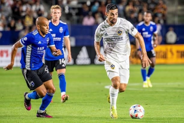 Sebastian Lletget of Los Angeles Galaxy controls the ball against Judson of the San Jose Earthquakes defends during the game at the Dignity Health...