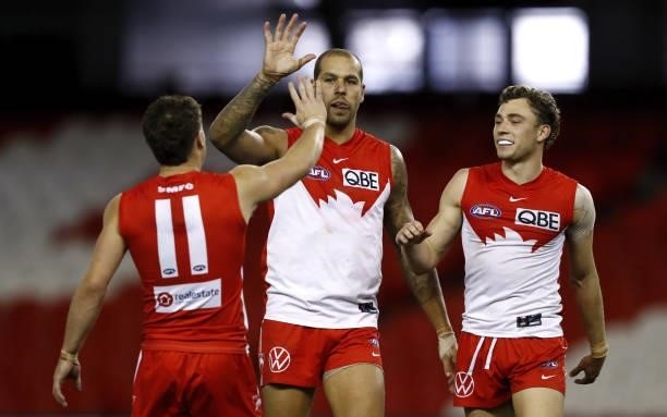 Lance Franklin of the Swans celebrates a goal with Will Hayward of the Swans and Tom Papley of the Swans during the 2021 AFL Round 23 match between...