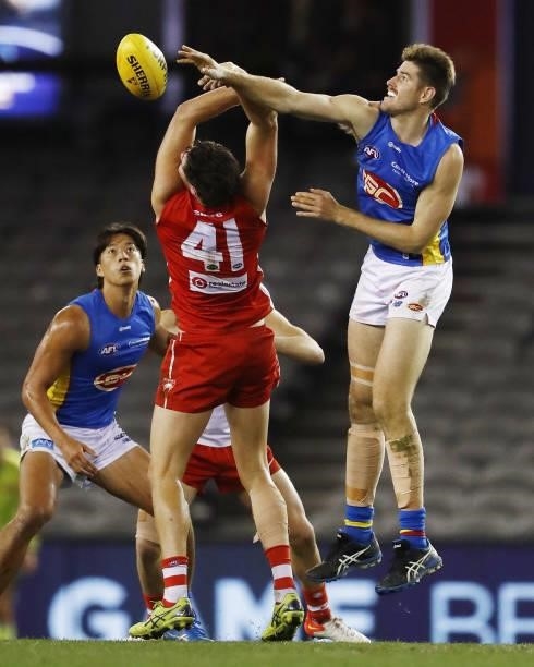 Zac Smith of the Suns and Hayden McLean of the Swans compete for the ball during the 2021 AFL Round 23 match between the Sydney Swans and the Gold...