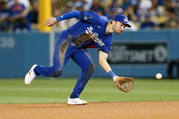 Trea Turner of the Los Angeles Dodgers tries to make a play on the ball during the game between the New York Mets and the Los Angeles Dodgers at...