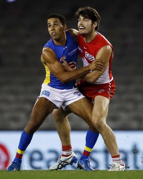 Touk Miller of the Suns and George Hewett of the Swans compete for the ball during the 2021 AFL Round 23 match between the Sydney Swans and the Gold...