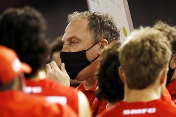 John Longmire, Senior Coach of the Swans addresses his players during the 2021 AFL Round 23 match between the Sydney Swans and the Gold Coast Suns at...