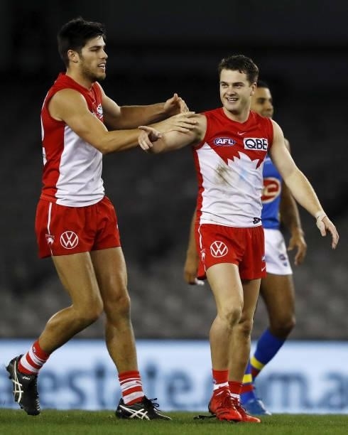 Tom Papley of the Swans celebrates a goal with Lewis Melican of the Swans during the 2021 AFL Round 23 match between the Sydney Swans and the Gold...