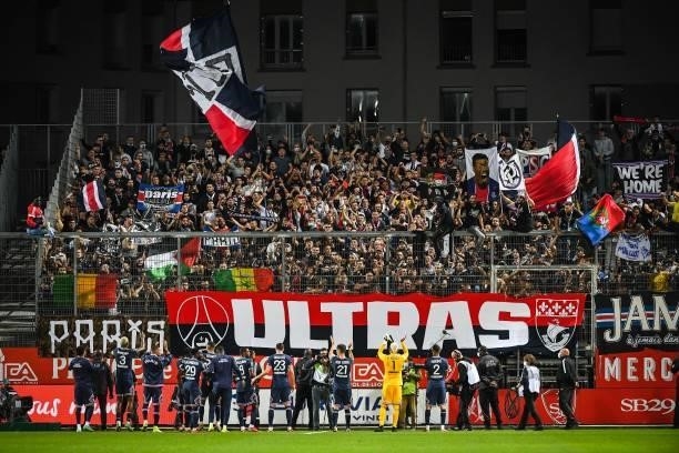 The team of PSG celebrate the victory with supporters during the Ligue 1 Uber Eats match between Brest and Paris Saint Germain at Stade Francis Le...