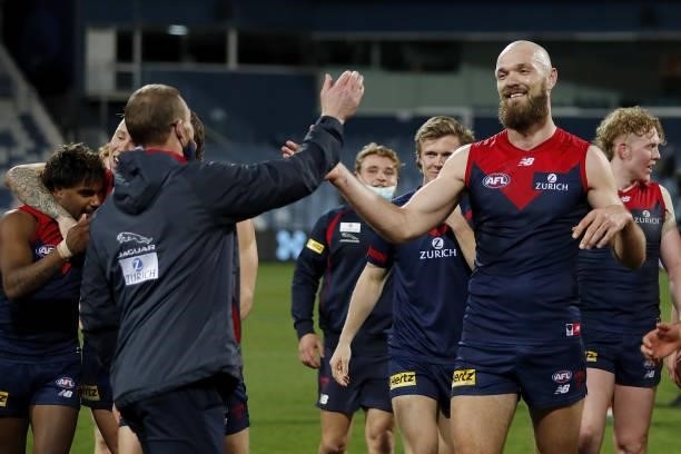 Max Gawn of the Demons celebrates with Simon Goodwin, Senior Coach of the Demons during the 2021 AFL Round 23 match between the Geelong Cats and the...